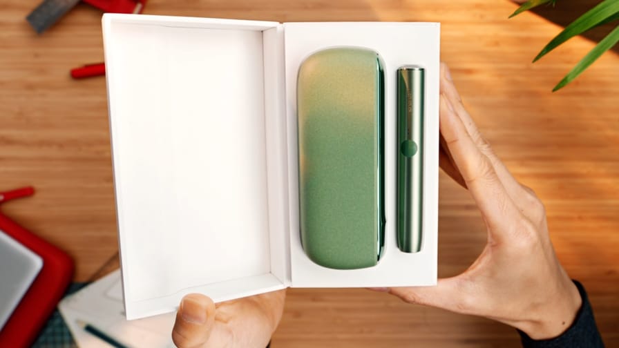 An IQOS ILUMA  Holder and Pocket Charger in a box.