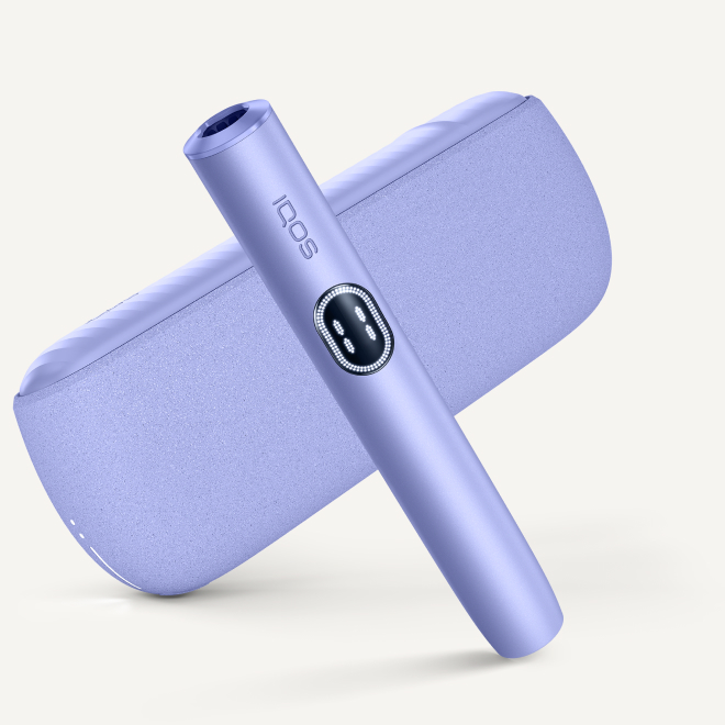 Violet IQOS ILUMA i device above its charger